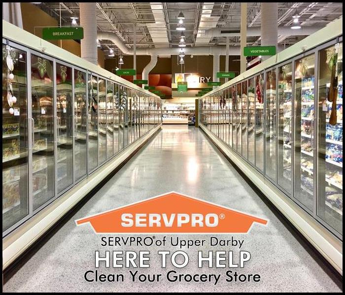 Grocery store with SERVPRO's Here to Help logo